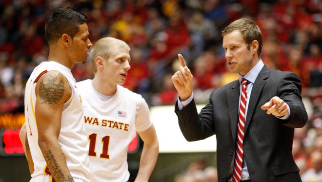 Coach Fred Hoiberg talks with Chris Babb and Scott Christopherson during their game against Iowa on Dec. 9, 2011, at Hilton Coliseum in Ames.
