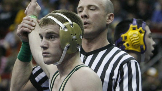 2008: Nate Moore of Iowa City West has his hand raised in victory after beating Casey Strub of Indianola in the Class 3A state wrestling tournament.
