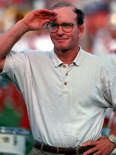 On Aug. 30, 1997, Dan Gable aknowledges the standing ovation and roar of the crowd with a return salute as he was inducted into the Iowa State Sports Hall of Fame during a half time ceremony of the Oklahoma State vs. Iowa State football game in Ames.