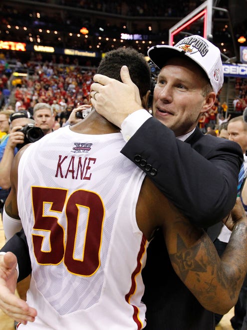 Iowa State coach Fred Hoiberg embraces sernior guard DeAndre Kane after the Cyclones won the Big 12 tournament championship on March 15, 2014, in Kansas City, Mo.