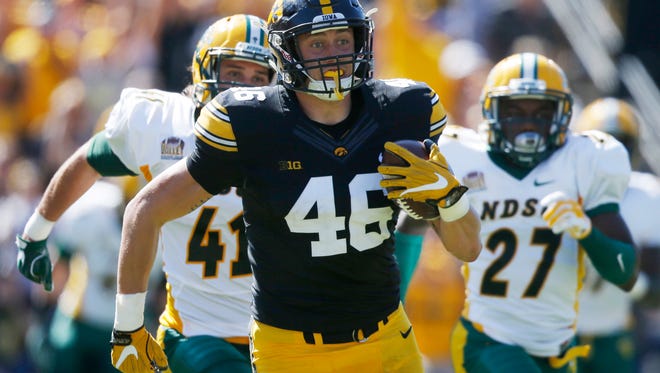 Iowa wide receiver George Kittle (46) runs the ball as he breaks away from the North Dakota State defense Saturday, Sept. 17, 2016 during the Hawkeyes game against the Bison at Kinnick Stadium in Iowa City.