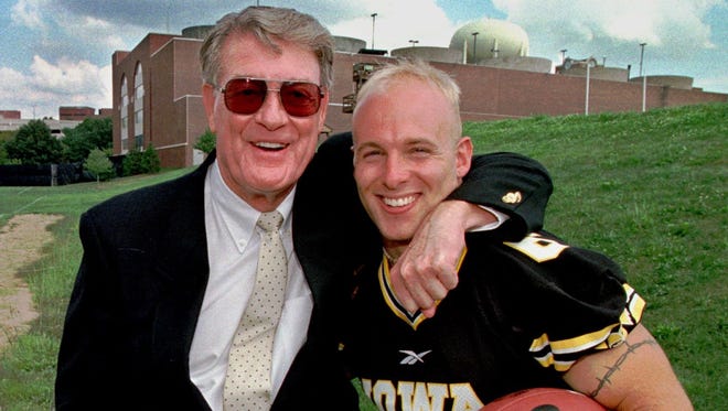 Former Iowa coach Hayden Fry and former all-American Tim Dwight are shown together at the Hawkeyes' media day in 1997.