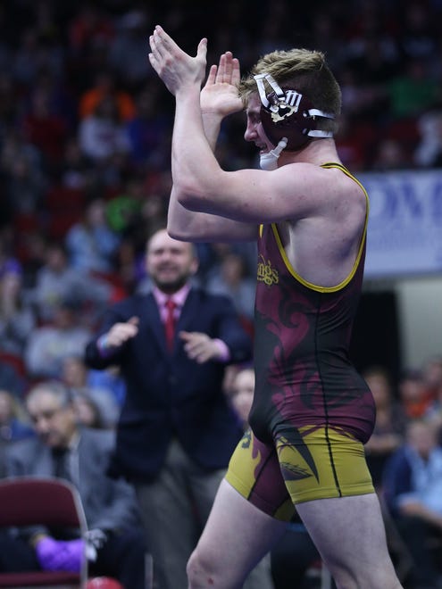 PCM's Lucas Roland wins his match against Wahlert's Kolton Bartow during the championship round of the class 2A Iowa high school state wrestling tournament on Saturday, Feb. 17, 2018, in Wells Fargo Arena.