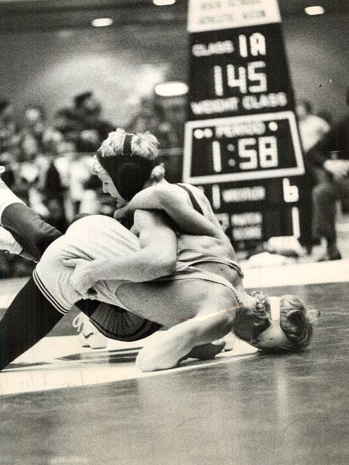 From 1975: Gladbrook's Donn Diercks (top) flips Tri-Center of Neola's Steve Pogge in consolations of the State Class A wrestling tournament at Veterans Memorial Auditorium. Diercks claimed third place at 145 pounds by posting a 4-1 decision.