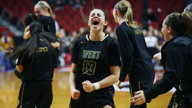 Iowa City West's Rachael Saunders celebrates after winning the Class 5A Girls' state basketball quarterfinal game between Dowling Catholic and Iowa City West on Monday, Feb. 26, 2018, in Wells Fargo Arena.