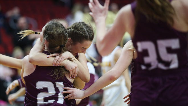 Grundy Center players celebrate after winning the Class 2A Girls' state basketball quarterfinal game between Iowa City Regina and Grundy Center on Tuesday, Feb. 27, 2018, in Wells Fargo Arena. Grundy Center won the game, 46-45.