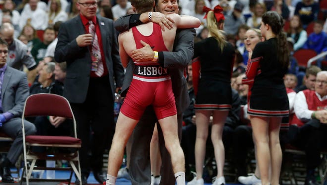 Lisbon's Cael Happel celebrates a 1A state title at 113 pounds after a tech fall win over Capello's Devon Meeker during the Iowa Class 1A wrestling finals on Saturday, Feb. 18, 2017, at Wells Fargo Arena in Des Moines.