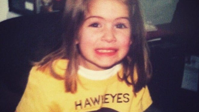 A young Kate Martin wears a shirt of her dream school, Iowa. She committed to the Hawkeyes Monday night. Courtesy of the Martin family.