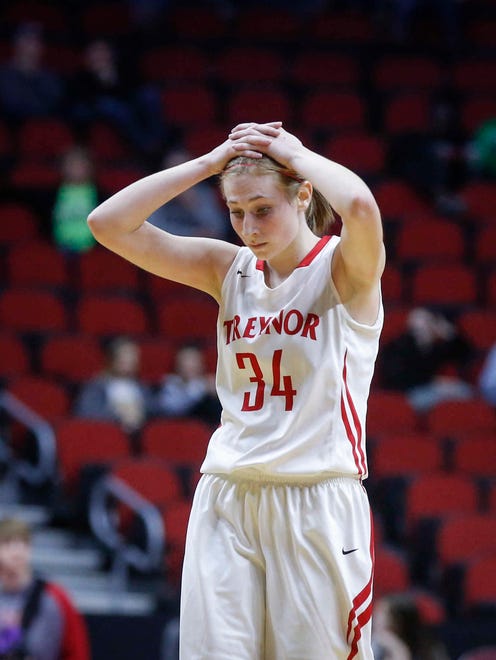 Treynor junior Kayla Chapman holds her head after the Cardinals lost to Grundy Center in the Class 2A semifinals on Friday, March 2, 2018, at Wells Fargo Arena in Des Moines.
