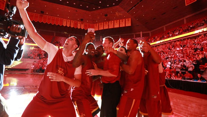 Iowa State basketball players snap a selfie with Coach Fred Hoiberg at the start of the first-ever Hilton Madness event on Oct. 18, 2014, at Hilton Coliseum in Ames.