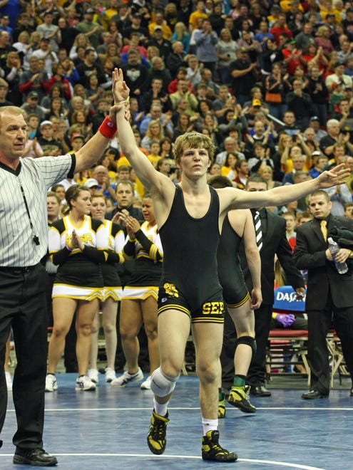 Cory Clark of Southeast Polk becomes a four-time state champion at Wells Fargo Arena in 2012. He is the twenty first wrestler to achieve a fourth state title.