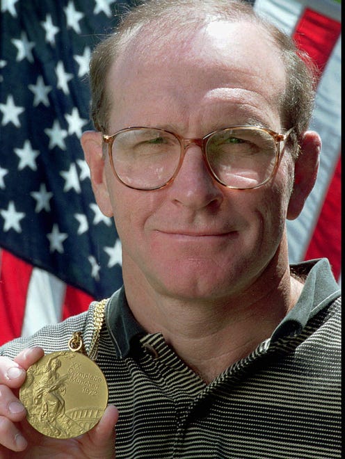 In 1996, Dan Gable displays the gold medal in Iowa City, Iowa on Wednesday, July 10, 1996, that he won as a 149.5-pound freestyle wrestler at the 1972 Olympics in Munich, West Germany. Gable won the gold without allowing a point to be scored against him.