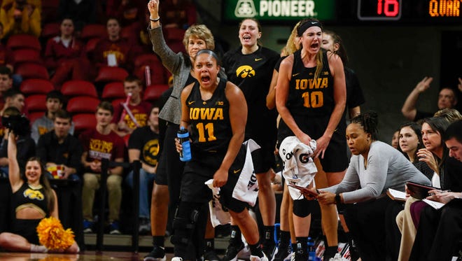 Iowa women's basketball coach Lisa Bluder and the Hawkeye bench react after a three-point field goal against Iowa State on Wednesday, Dec. 6, 2017, at Hilton Coliseum in Ames.
