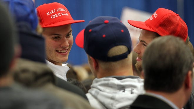 Attendees wait for Republican presidential candidate Donald Trump at the University of Iowa Field House in Iowa City on Tuesday, Jan. 26, 2016.