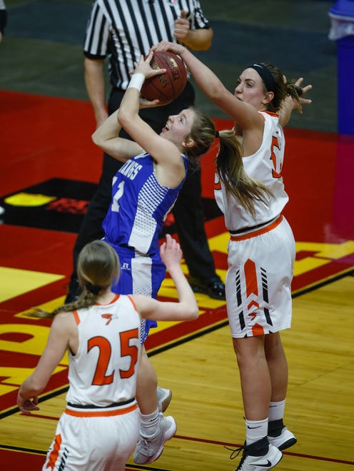 Springville's Mikayla Nachazel (51) blocks the shot of Newell-Fonda's Olivia Larsen (40) during the first half of their 1A girls state basketball championship game at Wells Fargo Arena on Saturday, March 3, 2018, in Des Moines. Springville takes a 25-20 lead into halftime.
