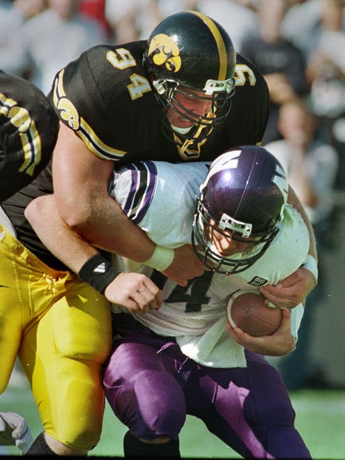 From 1998: Jared DeVries sacks Northwestern quarterback Gavin Hoffman for a loss of 8 yards during the first quarter at Kinnick Stadium. DeVries had two sacks against the Wildcats.