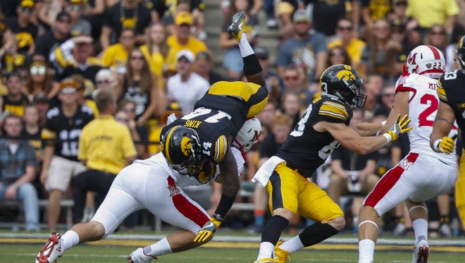 Iowa punt returner Desmond King is upended after running back a kickoff against Miami (Ohio) on Saturday, Sept. 3, 2016, at Kinnick Stadium in Iowa City.
