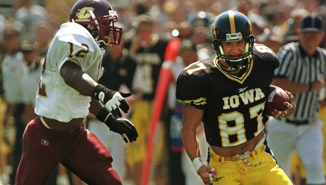 From 1998: Iowa's Kevin Kasper gains 40 yards in the third quarter on pass from Randy Reiners against Central Michigan.