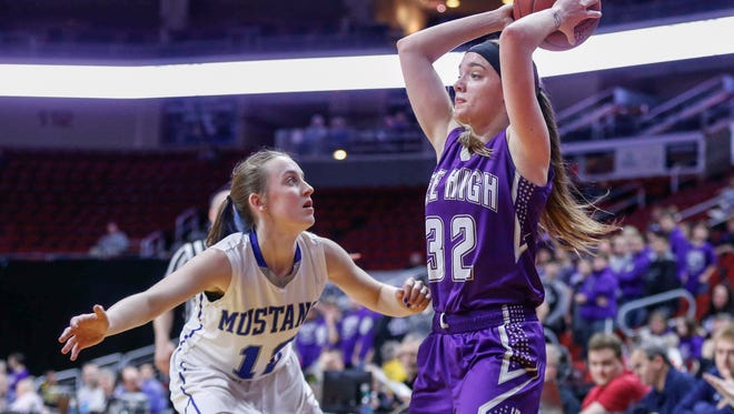 Kee High's Makayla Walleser looks for an open teammate for the bass as she is pressed by Newell-Fonda's Camryn Wilken during the 2018 Iowa Class 1A girls state basketball quarterfinal game on Tuesday, Feb. 28, 2018, at Wells Fargo Arena in Des Moines