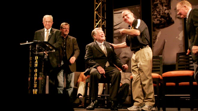 Dan Gable jokes with former Iowa football coach Hayden Fry during "This Is Your Life, Dan Gable" at the Coralville Marriott Hotel and Convention Center kicking off FryFest 2011 on Sept. 2 in Coralville.