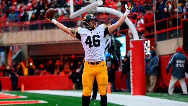 Iowa tight end George Kittle (46) celebrates his touchdown catch during the first half of an NCAA college football game against Nebraska in Lincoln, Neb., Friday, Nov. 27, 2015.