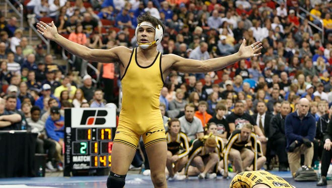 Bettendorf's Fredy Stroker wins over Southeast Polk's Aaron Meyer in the finals of the 3A-145 match Saturday, Feb. 21, 2015, at the State Wresting Tournament at Wells Fargo Arena in Des Moines.