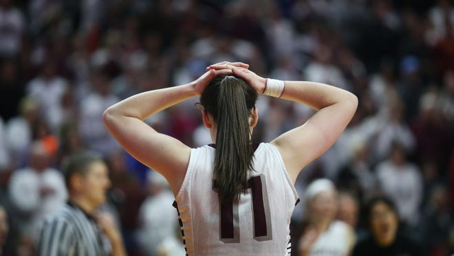 Dowling's Caitlin Clark reacts as the Class 5A Girls' state basketball quarterfinal goes into overtime on Monday, Feb. 26, 2018, in Wells Fargo Arena.