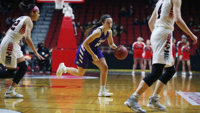 Indianola's Madie Sorensen dribbles the ball during the Class 5A Girls' state basketball quarterfinal game between Indianola and Cedar Falls on Monday, Feb. 26, 2018, in Wells Fargo Arena. Indianola won the game 64-63.
