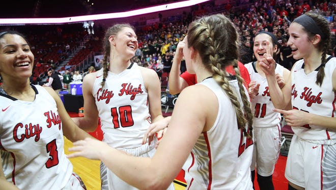 City High celebrates winning the Class 5A Girls' state basketball semifinal game between Johnston and Iowa City High on Thursday, March 1, 2018, in Wells Fargo Arena. City High won the game, 58-52, to advance to the state final.