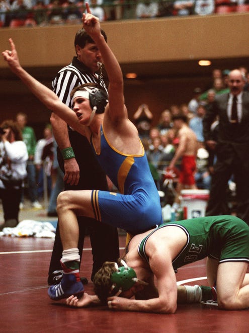 From 1995: Corey Stanley of Wilton celebrates after winning the Class 2-A 119-pound state championship against Doug Schwab of Osage.