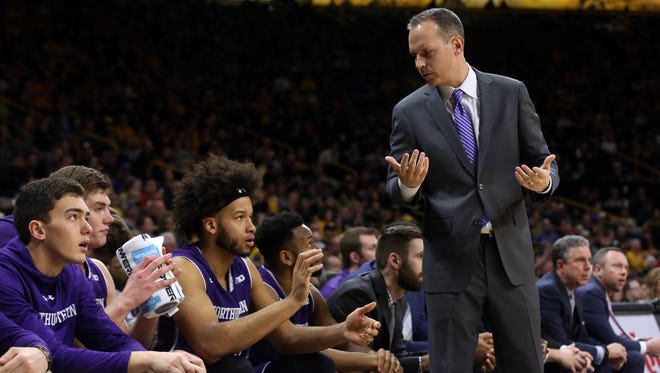 Northwestern head coach Chris Collins talks to players during their game against Iowa at Carver-Hawkeye Arena on Sunday, Feb. 25, 2018.