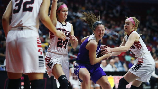 Indianola's Madie Sorensen tries to hang on to the ball during the Class 5A Girls' state basketball quarterfinal game between Indianola and Cedar Falls on Monday, Feb. 26, 2018, in Wells Fargo Arena.
