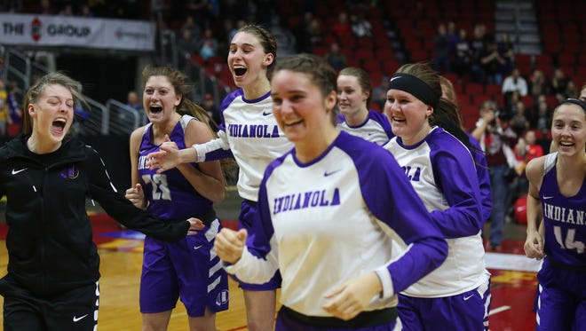 Indianola players celebrate after winning the Class 5A Girls' state basketball quarterfinal game between Indianola and Cedar Falls on Monday, Feb. 26, 2018, in Wells Fargo Arena. Indianola won the game 64-63.