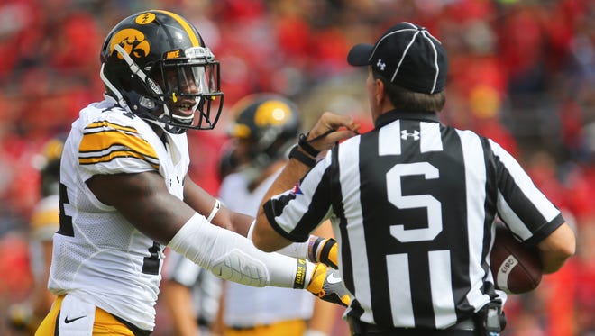 Desmond King discusses things with an official during Iowa's 14-7 win Saturday at Rutgers. For the second straight week, King is not a gameday captain. It'll be C.J. Beathard, LeShun Daniels Jr., injured Matt VandeBerg and Josey Jewell.