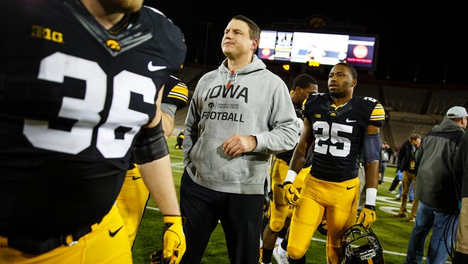Iowa offensive coordinator Brian Ferentz walks off the field with his players after their Spring Game on Friday, April 21, 2017, in Iowa City.