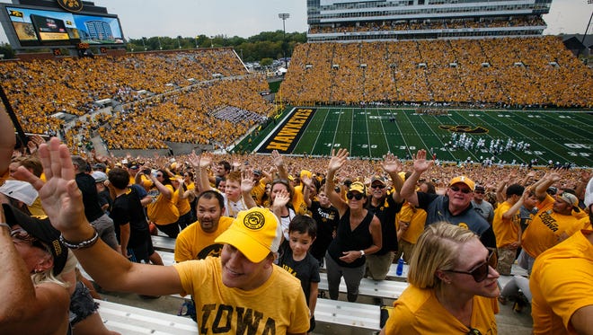 Fans wave to children at the University of Iowa Stead Family ChildrenÕs Hospital after the first quarter of the Iowa football game against North Texas at Kinnick Stadium on Saturday, Sept. 16, 2017, in Iowa City.