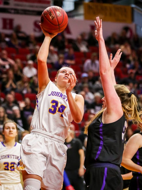 Johnston's (34) Jennah Johnson shoots over Waukee's(52) Lexi Boles during their first round 5A matchup in the girls' state basketball tournament Monday, Feb. 26, 2018, at Wells Fargo Arena in Des Moines, Iowa.