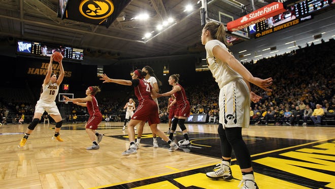 Iowa's Megan Gustafson takes a pass during the Hawkeyes' WNIT Elite Eight game against Washington State at Carver-Hawkeyes Arena on Sunday, March 26, 2017.