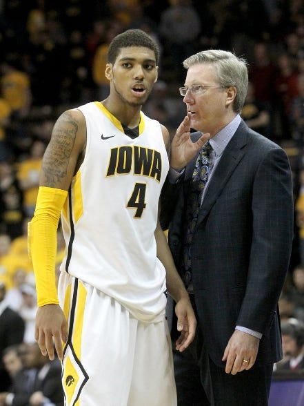 Iowa head coach Fran McCaffery talks with Devyn Marble during a 78-66 win for the Hawkeyes over the Indiana Hoosiers on Saturday, February 19, 2012.