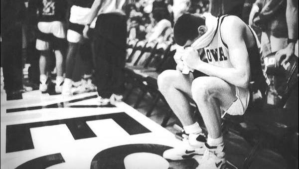 Street sits alone on the bench after fouling out in an overtime loss to Michigan in January of 1992.