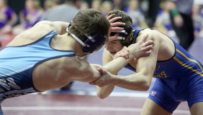 Martensdale-St. Marys sophomore 132-pounder Joshua Tibbits (right) wrestles Panorama senior George Appleseth in a Class 1A opening-round match at the state wrestling meet Feb. 16 at Wells Fargo Arena in Des Moines.