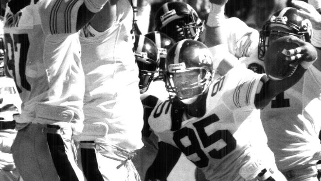From 1989: Iowa defender Larry Blue celebrates with teammates afer recovering a fumble for a touchdown in the Hawkeyes' 31-21 win against Iowa State.