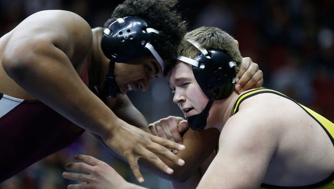 Mount Vernon's Tristan Wirfs (left) wrestles Atlantic's John McConkey in the class 2A, 220-pound title match Saturday, Feb. 18, 2017 in the state wrestling finals at Wells Fargo Arena in Des Moines.