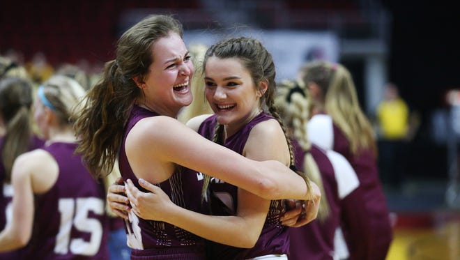 Grundy Center players celebrate after winning the Class 2A Girls' state basketball quarterfinal game between Iowa City Regina and Grundy Center on Tuesday, Feb. 27, 2018, in Wells Fargo Arena. Grundy Center won the game, 46-45.
