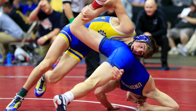 Blake Thomsen of Underwood and Daniel Meeker of Wapello wrestle at 120 pounds in the Class 1A quarter-finals Friday, Feb. 16, 2018.