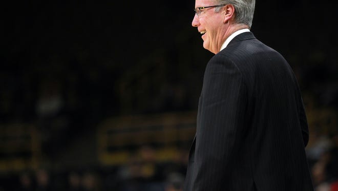 Iowa head coach Fran McCaffery jokes with a referee during the Hawkeyes' game against Ohio State at Carver-Hawkeye Arena on Thursday, Jan. 4, 2018.