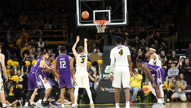 Iowa's Jordan Bohannon shoots a free throw, tying Chris Street's consecutive free throw record, during the Hawkeyes' game against Northwestern at Carver-Hawkeye Arena on Sunday, Feb. 25, 2018.