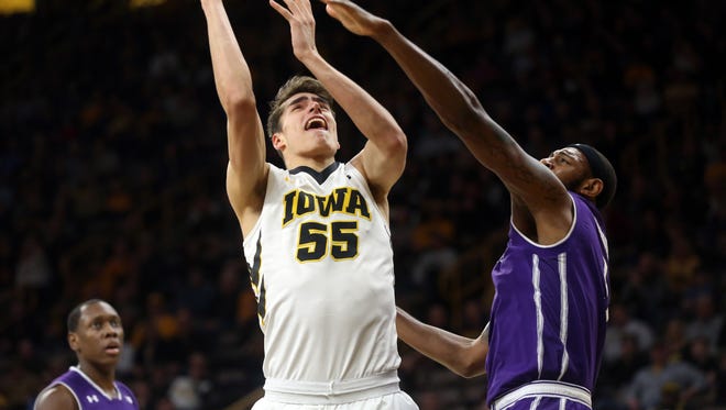 Iowa's Luka Garza puts up a shot during the Hawkeyes' game against Northwestern at Carver-Hawkeye Arena on Sunday, Feb. 25, 2018.