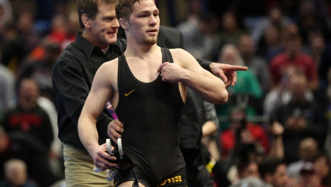 Iowa's Spencer Lee celebrates after winning the 125 pound national championship over Rutgers' Nick Suriano at the NCAA Wrestling Championships at Quicken Loans Arena in Cleveland, Ohio on Saturday, March 17, 2018.