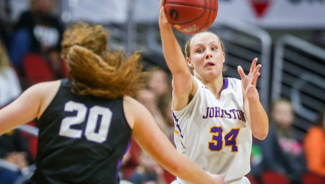 Johnston's (34) Jennah Johnson grabs a pass in front of Waukee's (20) Anna Brown during their first round 5A matchup in the girls' state basketball tournament Monday, Feb. 26, 2018, at Wells Fargo Arena in Des Moines, Iowa.